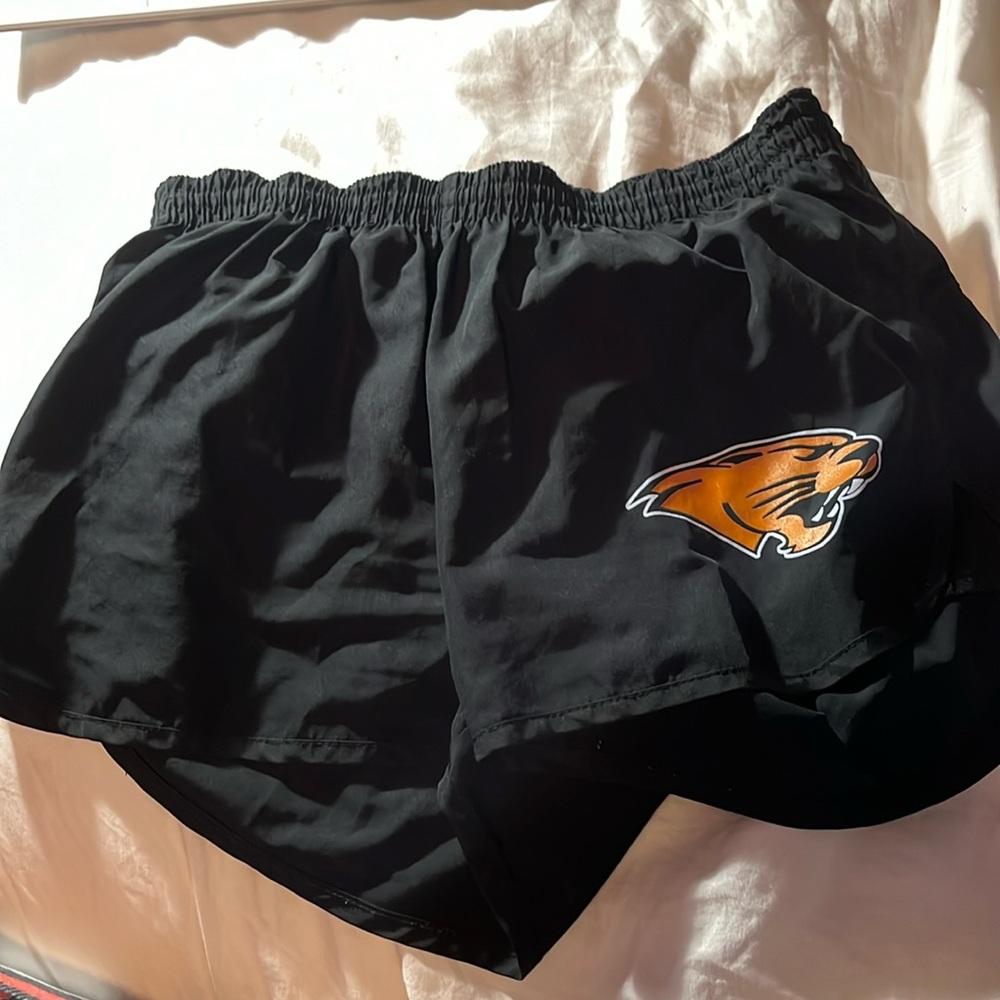 Black athletic shorts w/ orange panther (Oregon Panther). Size small.